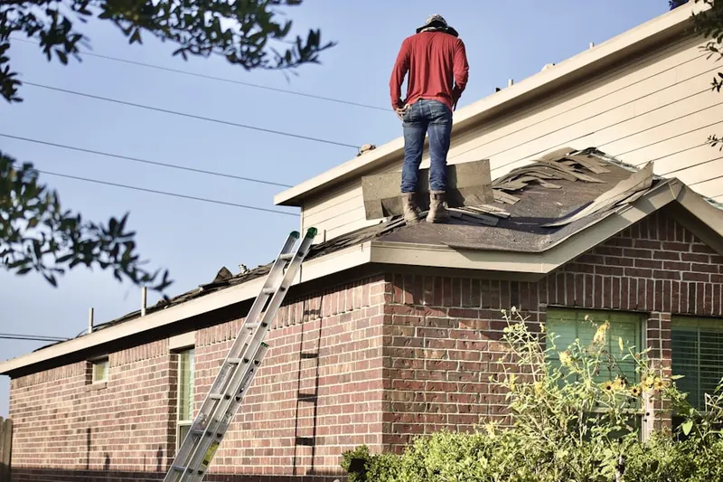 Professional roofer working on a residential roof in Ramirez Estates